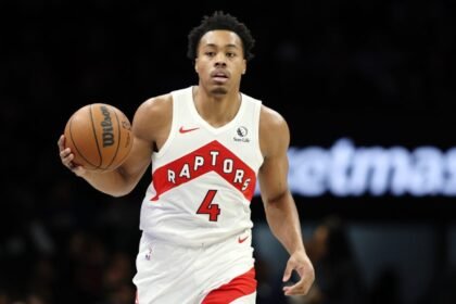 Toronto Raptors #4 Scottie Barnes dribbles during the first half against the Brooklyn Nets at Barclays Center.