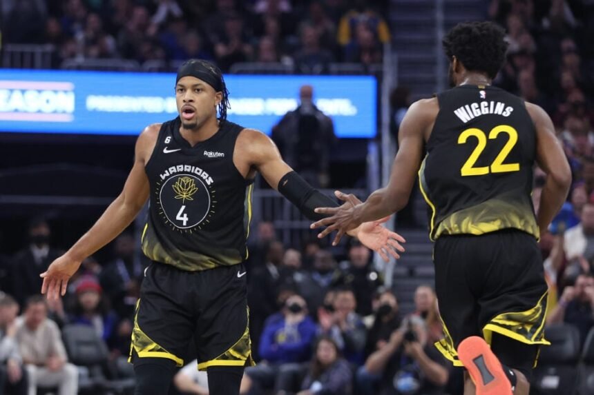 Golden State Warriors #4 Moses Moody celebrates a basket with Andrew Wiggins #22 during the second quarter against the Washington Wizards on February 13, 2023 at Chase Center in San Francisco, California.