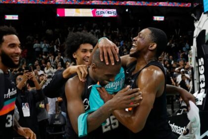 San Antonio Spurs No. 4 De'Aaron Fox celebrates with David Jones Garcia #25 of the San Antonio Spurs after defeating the Atlanta Hawks at Frostbank Center on November 20, 2025 in San Antonio, Texas.
