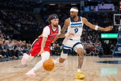 No. 15 Jose Alvarado of the New Orleans Pelicans takes on No. 9 Nickel Alexander Walker of the Minnesota Timberwolves at Target Center on March 19, 2025 in Minneapolis, Minnesota.