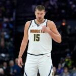 #15 Nikola Jokic of the Denver Nuggets takes on the Sacramento Kings during the second half of an NBA basketball game at Golden 1 Center.
