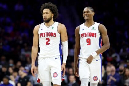 Cade Cunningham #2 and Orser Thompson #9 of the Detroit Pistons watch the second half of the game against the Philadelphia 76ers at Xfinity Mobile Arena.