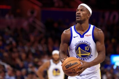 Jimmy Butler III #10 of the Golden State Warriors takes a technical foul shot in the second half of the game against the Orlando Magic.