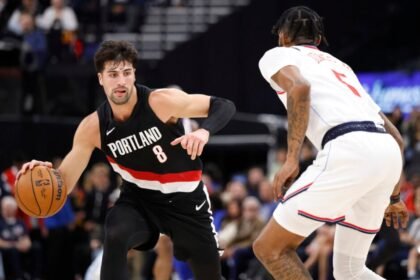 Portland Trail Blazers forward Deni Avdija drives with Los Angeles Clippers forward Derrick Jones Jr.